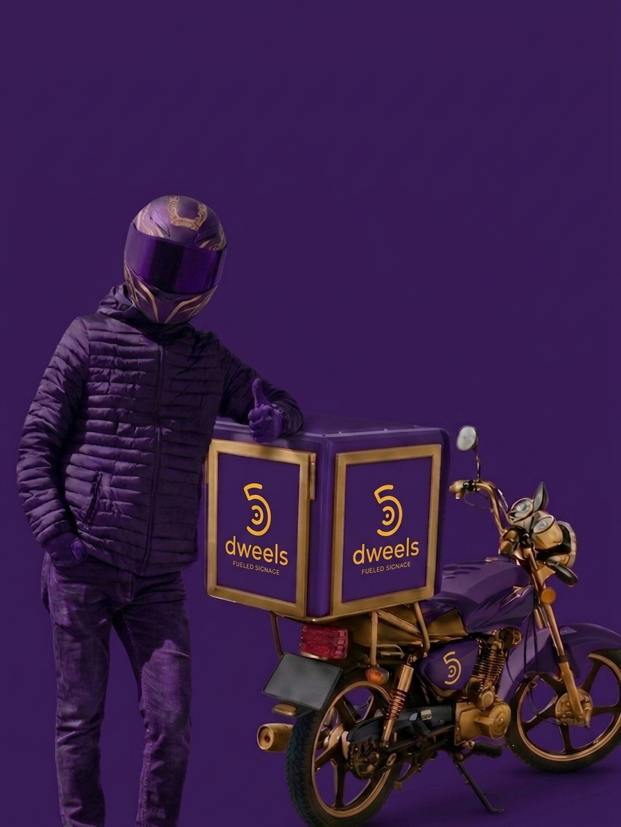 Delivery rider standing alongside a logistics motorcycle equipped with an integrated Dweels digital fueled signage system